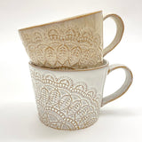 Happiness muki korvalla