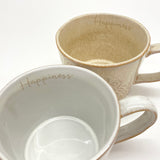 Happiness muki korvalla